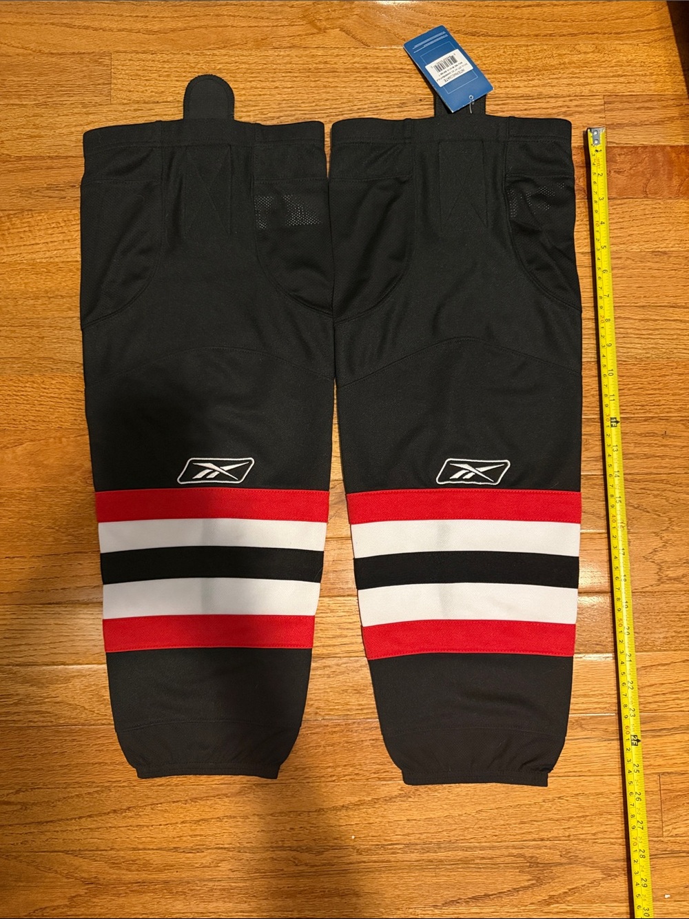Reebok hockey game Socks with Red, White & Black Stripes brand new.